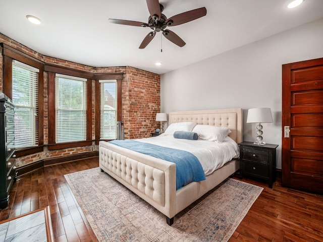 119 Miami Ave Unit 119, Columbus, OH 43203 - bedroom featuring brick wall, dark wood-style flooring, ceiling fan, and recessed lighting