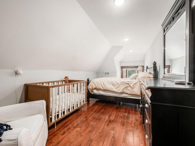 119 Miami Ave Unit 119, Columbus, OH 43203 - bedroom with wood-type flooring, lofted ceiling, and recessed lighting