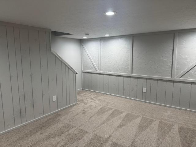 7771 Deercrest Ct, Dublin, OH 43016 - finished below grade area with wooden walls, carpet, and recessed lighting