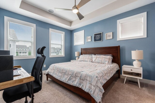 1232 N Grant Ave, Columbus, OH 43201 - carpeted bedroom featuring an office area, a raised ceiling, and ceiling fan