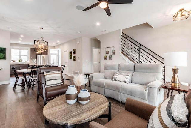 1232 N Grant Ave, Columbus, OH 43201 - living area featuring dark wood-style floors, a chandelier, a ceiling fan, recessed lighting, and stairs