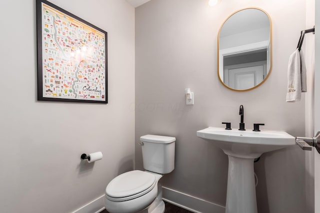 1232 N Grant Ave, Columbus, OH 43201 - half bathroom with baseboards and toilet