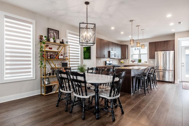1232 N Grant Ave, Columbus, OH 43201 - dining room with dark wood-style flooring, recessed lighting, and a chandelier