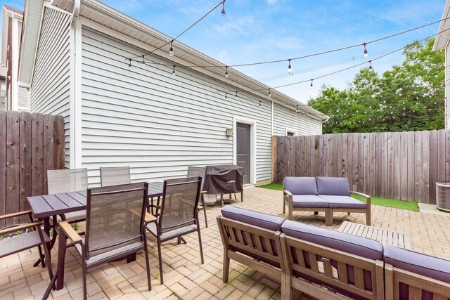 1232 N Grant Ave, Columbus, OH 43201 - fenced backyard with a patio, an outdoor hangout area, a grill, and outdoor dining area
