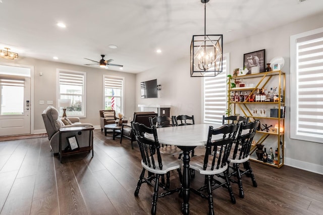 1232 N Grant Ave, Columbus, OH 43201 - dining room with dark wood-style flooring, recessed lighting, ceiling fan, and a chandelier