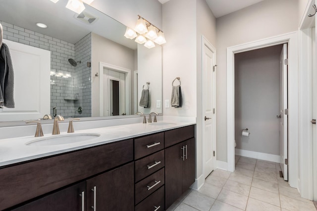 1232 N Grant Ave, Columbus, OH 43201 - bathroom with double vanity, a tile shower, and tile patterned floors
