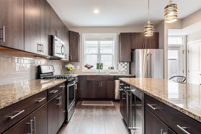 1232 N Grant Ave, Columbus, OH 43201 - kitchen with appliances with stainless steel finishes, wine cooler, healthy amount of natural light, dark wood-style flooring, and recessed lighting