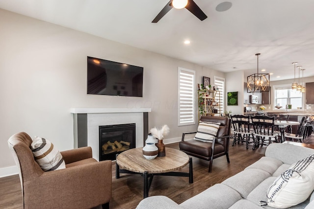 1232 N Grant Ave, Columbus, OH 43201 - living area featuring a chandelier, recessed lighting, a glass covered fireplace, ceiling fan, and wood finished floors