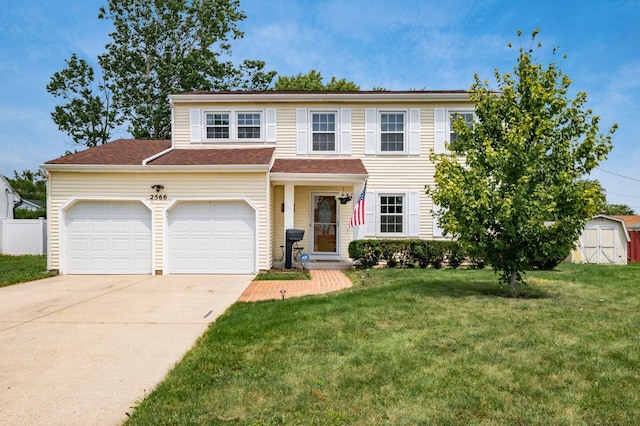 2566 Mcdaniel Ct, Grove City, OH 43123 - view of front of home with a storage unit, concrete driveway, a front lawn, and a garage