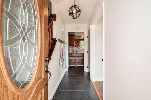 2566 Mcdaniel Ct, Grove City, OH 43123 - foyer entrance featuring a chandelier and dark tile patterned floors
