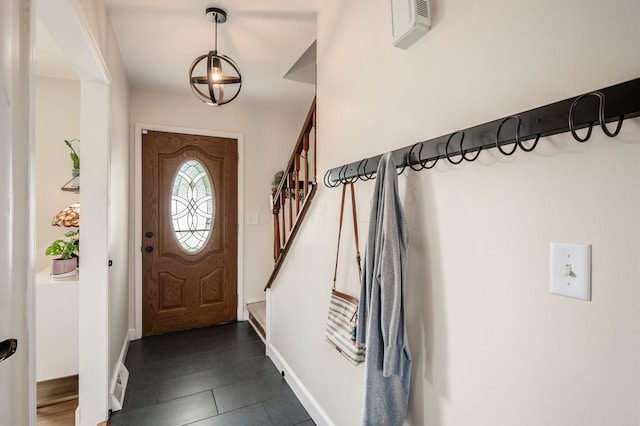 2566 Mcdaniel Ct, Grove City, OH 43123 - foyer featuring stairway, a chandelier, and dark tile patterned flooring