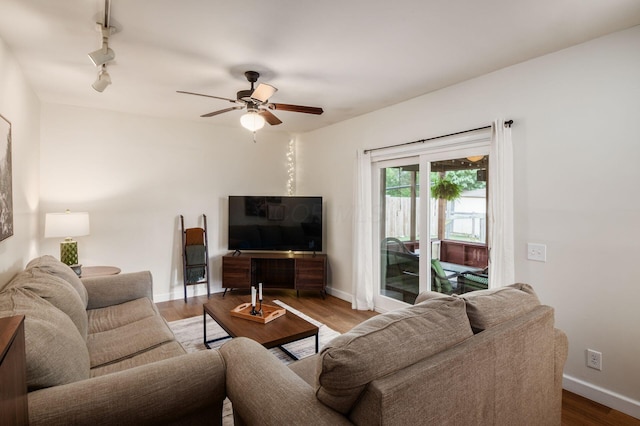 2566 Mcdaniel Ct, Grove City, OH 43123 - living area with a ceiling fan, wood finished floors, and rail lighting