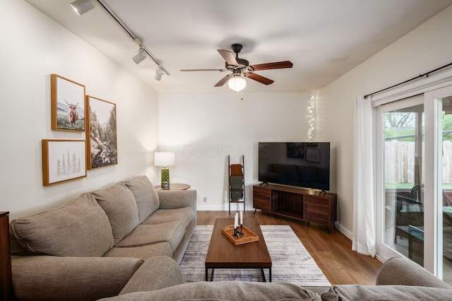 2566 Mcdaniel Ct, Grove City, OH 43123 - living area with rail lighting, ceiling fan, and wood finished floors