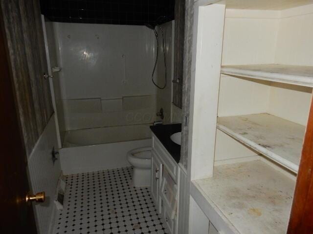 1549 Alpine Dr, Columbus, OH 43229 - full bathroom featuring vanity, tile patterned flooring, and washtub / shower combination