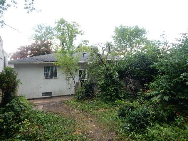 1549 Alpine Dr, Columbus, OH 43229 - back of house with stucco siding