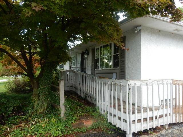 1549 Alpine Dr, Columbus, OH 43229 - view of side of home with stucco siding