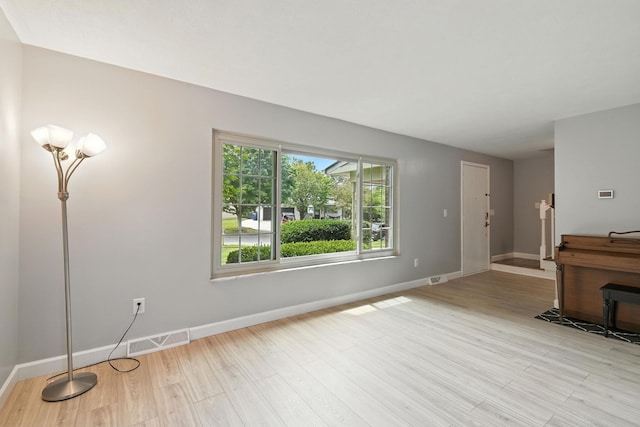 2036 Queensbridge Dr, Columbus, OH 43235 - unfurnished living room featuring light wood-type flooring and baseboards