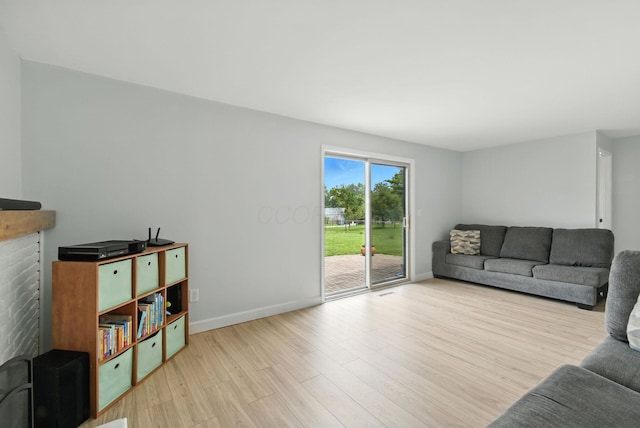 2036 Queensbridge Dr, Columbus, OH 43235 - living room with wood finished floors and a brick fireplace