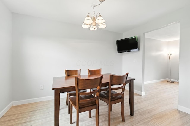 2036 Queensbridge Dr, Columbus, OH 43235 - dining area featuring a chandelier and light wood finished floors