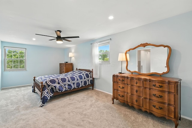 2036 Queensbridge Dr, Columbus, OH 43235 - carpeted bedroom featuring multiple windows, ceiling fan, and recessed lighting