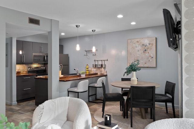 1481 Cliff Ct Unit 58-A, Columbus, OH 43204 - dining space with recessed lighting and wood finished floors