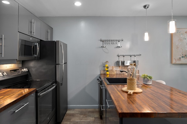 1481 Cliff Ct Unit 58-A, Columbus, OH 43204 - kitchen with butcher block countertops, stainless steel appliances, recessed lighting, gray cabinets, and dark wood-type flooring