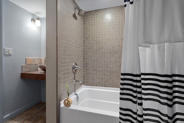 1481 Cliff Ct Unit 58-A, Columbus, OH 43204 - bathroom featuring shower / bath combination with curtain and wood finished floors