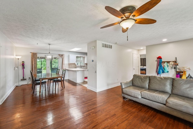 9900 Waterloo Eastern Rd, Canal Winchester, OH 43110 - living room with a textured ceiling, hardwood / wood-style flooring, ceiling fan, recessed lighting, and a chandelier