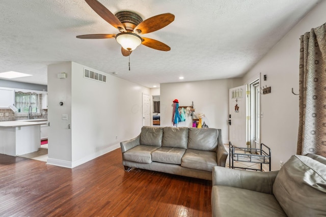 9900 Waterloo Eastern Rd, Canal Winchester, OH 43110 - living room with wood finished floors, a textured ceiling, a ceiling fan, and recessed lighting