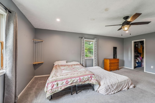 9900 Waterloo Eastern Rd, Canal Winchester, OH 43110 - carpeted bedroom featuring ceiling fan, a walk in closet, a textured ceiling, and recessed lighting