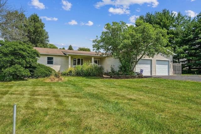 9900 Waterloo Eastern Rd, Canal Winchester, OH 43110 - view of front facade with driveway, a front yard, brick siding, and an attached garage