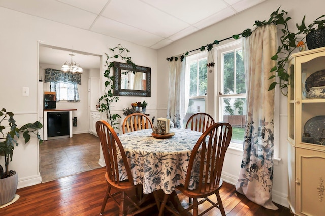 220 Robinwood Ave, Columbus, OH 43213 - dining room featuring hardwood / wood-style flooring, a chandelier, and a drop ceiling