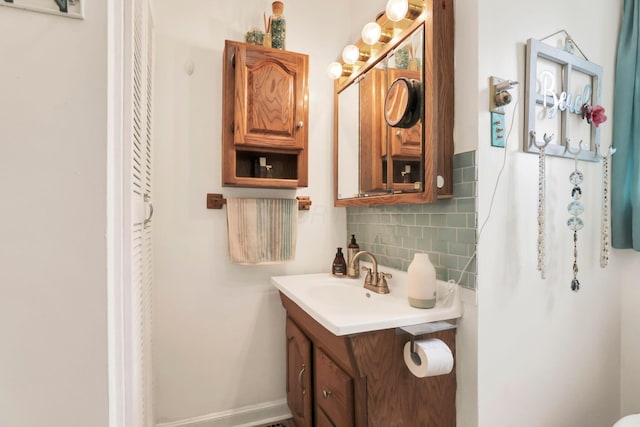 220 Robinwood Ave, Columbus, OH 43213 - bathroom featuring vanity and tasteful backsplash