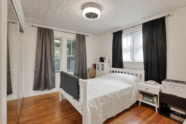 220 Robinwood Ave, Columbus, OH 43213 - bedroom featuring multiple windows and wood finished floors