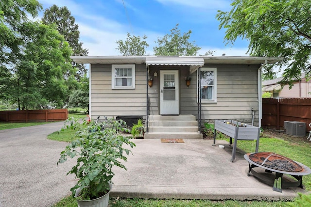 220 Robinwood Ave, Columbus, OH 43213 - view of front facade featuring an outdoor fire pit, entry steps, and a patio