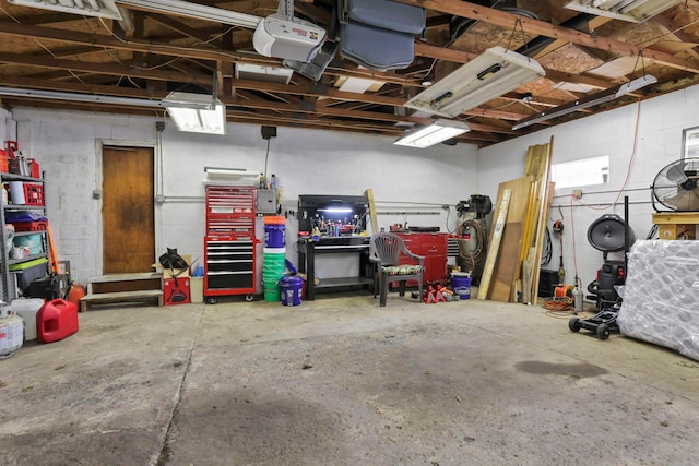 220 Robinwood Ave, Columbus, OH 43213 - garage featuring a workshop area and concrete block wall