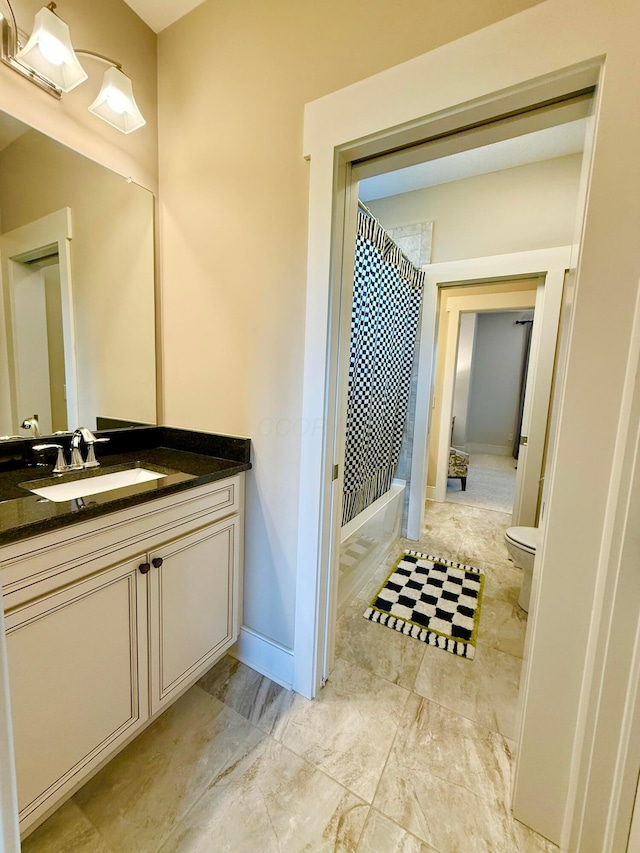 2000 Forestview Ln, Delaware, OH 43015 - bathroom featuring vanity, shower / tub combination, and marble look tile flooring