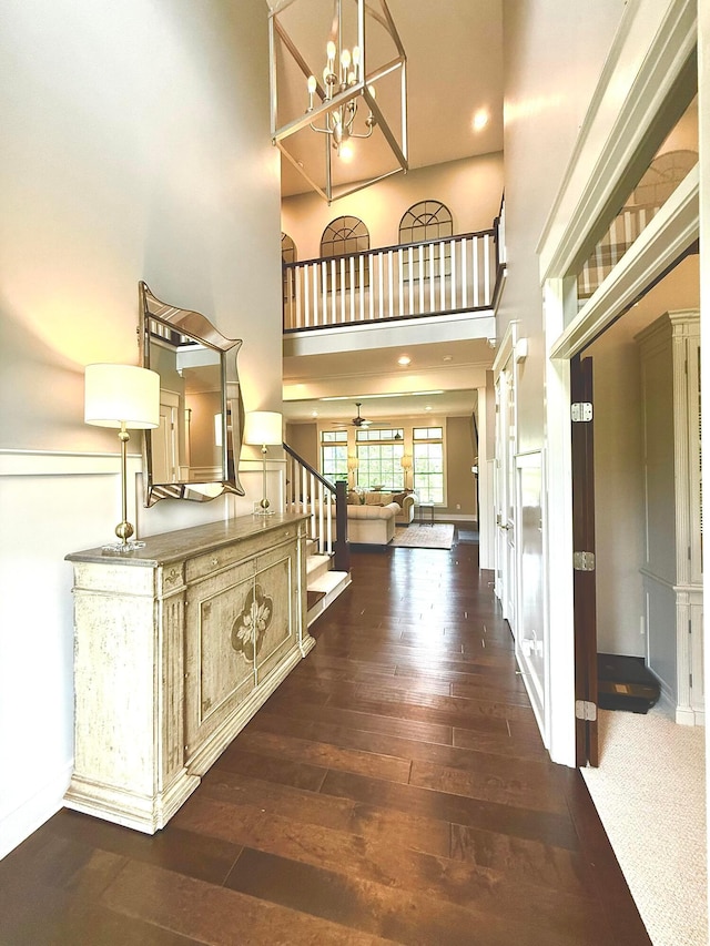 2000 Forestview Ln, Delaware, OH 43015 - entrance foyer with a chandelier, dark wood-style flooring, a high ceiling, stairway, and recessed lighting