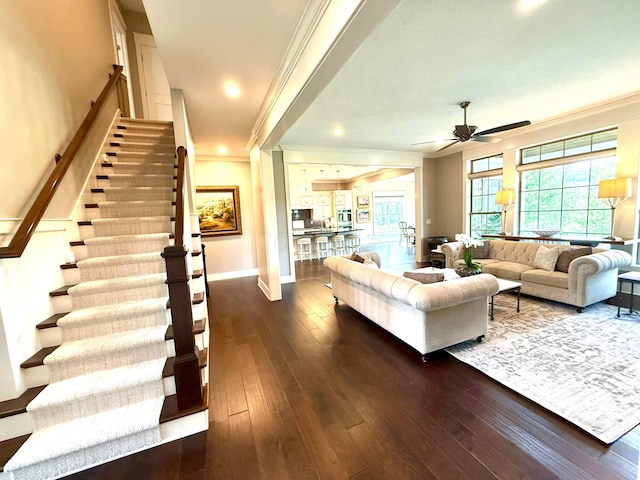 2000 Forestview Ln, Delaware, OH 43015 - living area featuring crown molding, a ceiling fan, dark wood-style floors, stairway, and recessed lighting