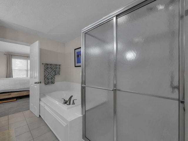 1235 Shagbark Rd, Columbus, OH 43230 - bathroom with a bath, connected bathroom, a stall shower, and tile patterned floors