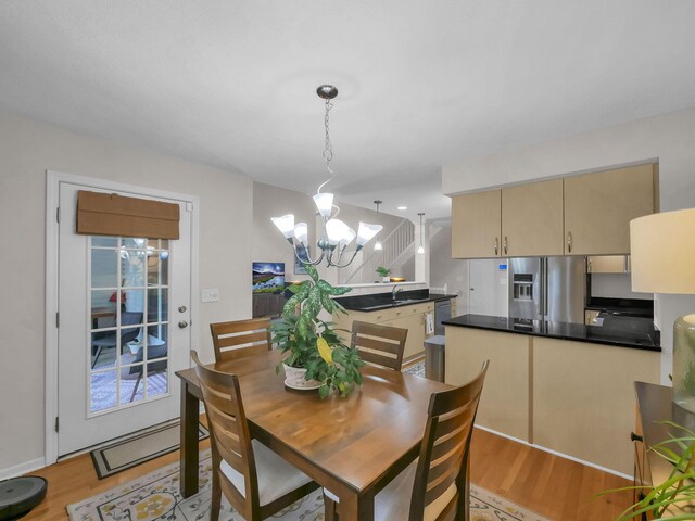 1235 Shagbark Rd, Columbus, OH 43230 - dining room with a chandelier and light wood-style floors