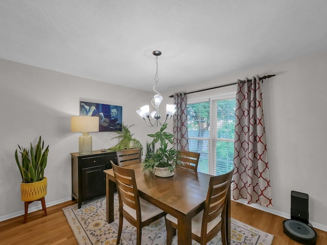 1235 Shagbark Rd, Columbus, OH 43230 - dining area with light wood-style flooring and a chandelier
