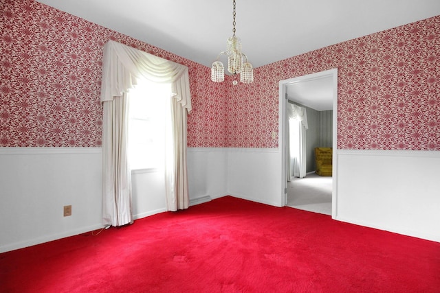 2399 Arabelle Dr NE, Lancaster, OH 43130 - carpeted spare room featuring wallpapered walls, a wainscoted wall, and a chandelier