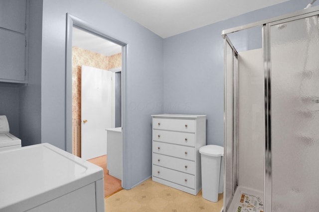 2399 Arabelle Dr NE, Lancaster, OH 43130 - full bath featuring tile patterned floors, a shower stall, separate washer and dryer, and vanity