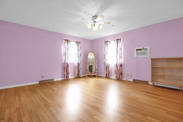 2399 Arabelle Dr NE, Lancaster, OH 43130 - unfurnished room with light wood-style flooring, ceiling fan, and a wall mounted air conditioner