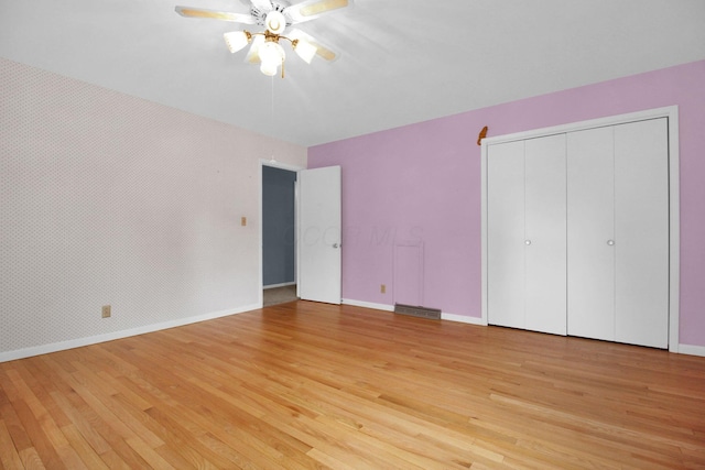 2399 Arabelle Dr NE, Lancaster, OH 43130 - unfurnished bedroom featuring light wood-type flooring, a ceiling fan, and a closet