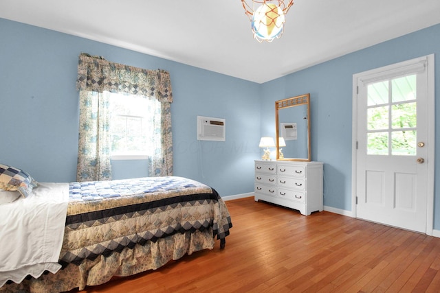 2399 Arabelle Dr NE, Lancaster, OH 43130 - bedroom featuring wood finished floors and a wall mounted AC