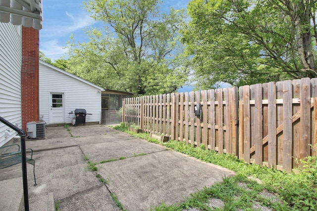 2399 Arabelle Dr NE, Lancaster, OH 43130 - fenced backyard featuring a patio area and a grill