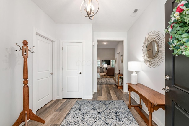 5540 Eva Loop S, Dublin, OH 43016 - foyer entrance with wood finished floors and a chandelier