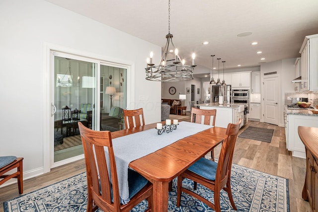 5540 Eva Loop S, Dublin, OH 43016 - dining room featuring a chandelier, light wood-style floors, and recessed lighting
